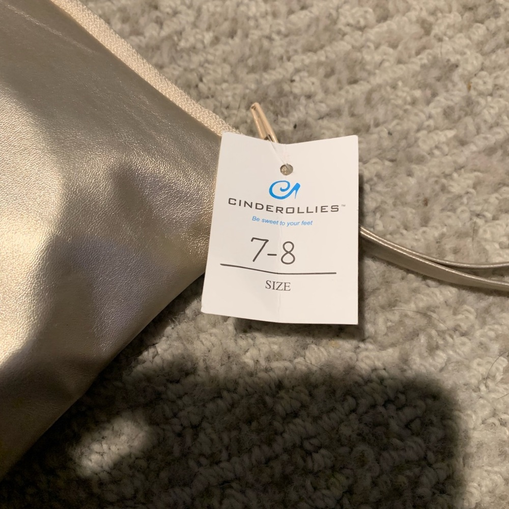 Never used gold cinderollies size 7-8